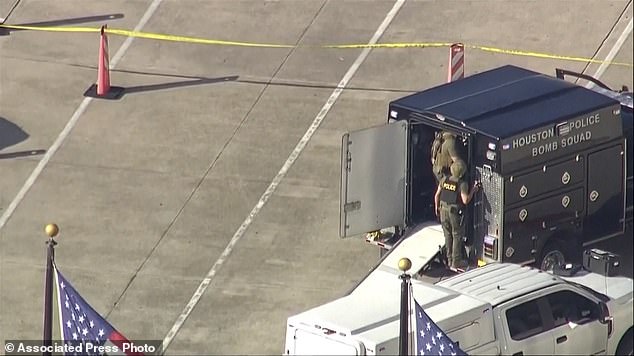 Members of the Houston Police Bomb Squad respond to a shooting at Lakewood Church