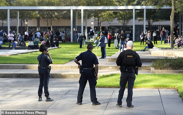 Worshipers could be seen leaving the building as authorities evacuated the church before the press conference