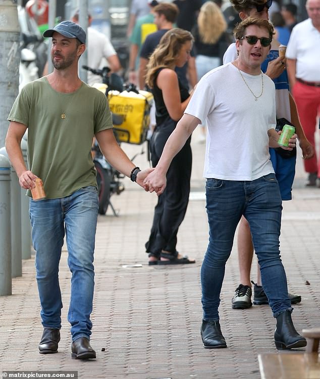 The pair stayed close as they strolled down the street and enjoyed the sunny day out