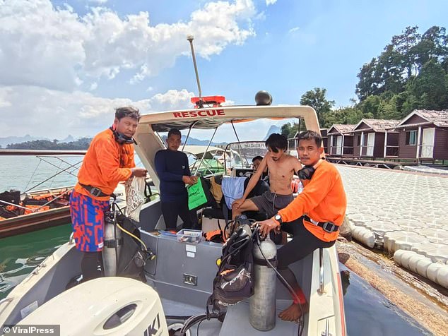 Rescue teams are searching for a British tourist who fell into the water while kayaking on a reservoir in Thailand