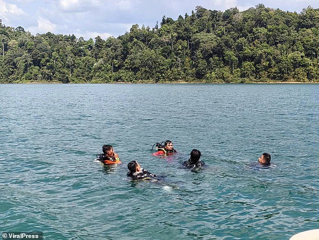 Divers were deployed to search the waters, but the operation was temporarily suspended due to safety concerns due to the depth of the dam