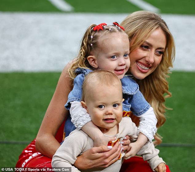 She was also spotted on the sidelines posing for photos with her and Patrick's two children: daughter Sterling, almost three, and 15-month-old son Bronze.