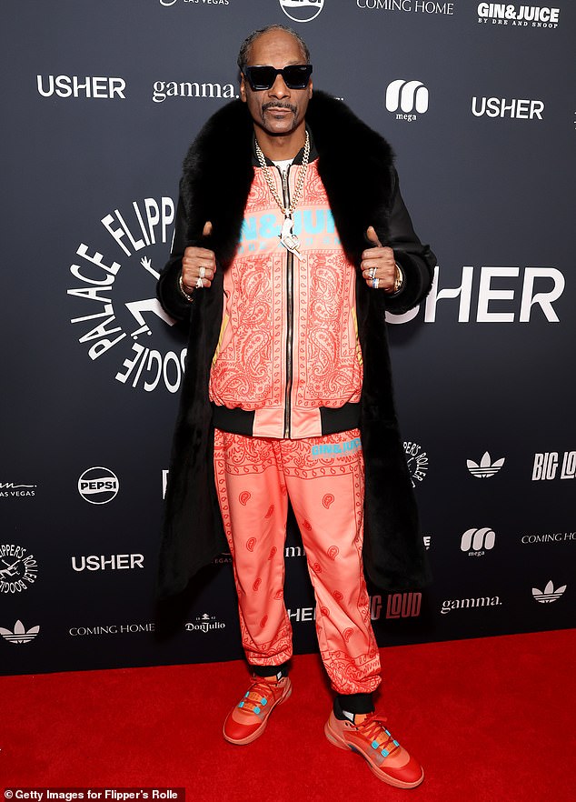 Snoop Dogg turned heads in a pink and red 'Gin & Juice' tracksuit, promoting his new drink inspired by his 2013 hit