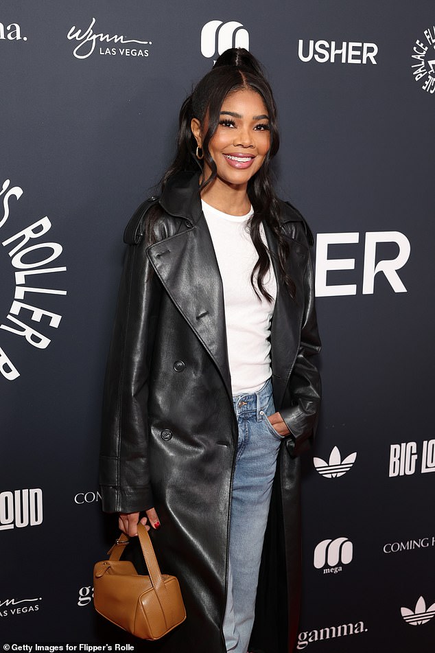 The Bring It On actress added a long black leather jacket over the number and added height to her frame with a pair of pointy boots