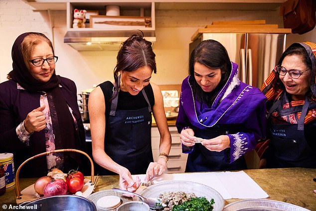 The Duchess of Sussex (center) prepared Afghan food on Saturday together with fifteen Afghan women who now live in the US