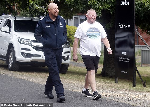 A smiling Mick Murphy was pictured at police last Friday - the day after his wife Samantha's dog Ruby went missing