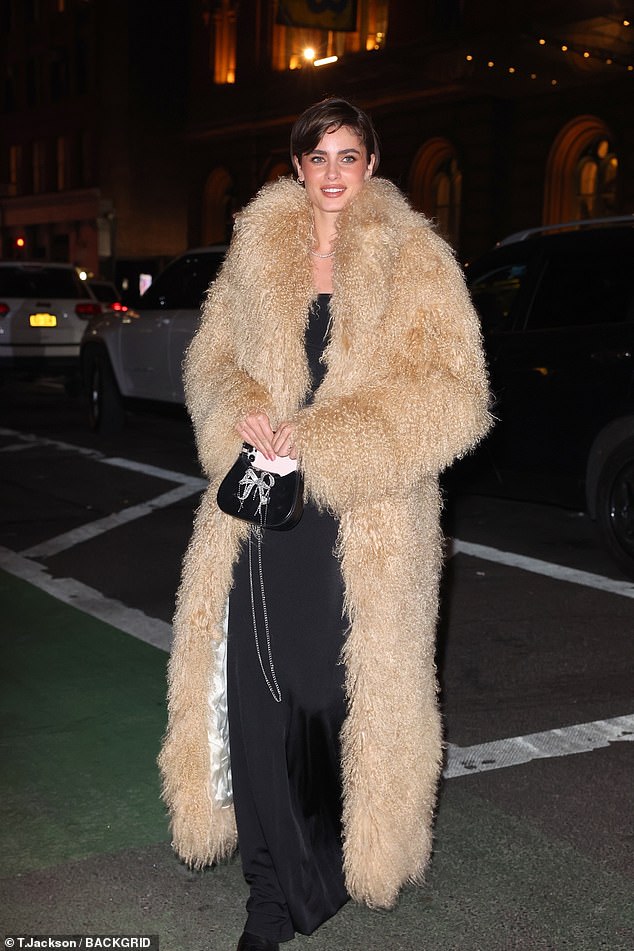 The model Taylor Hill was unmissable in a thick furry brown coat, although it was not clear whether it was real or faux fur