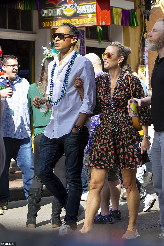 The couple wore strands of Mardi Gras beads around their necks ahead of the holiday