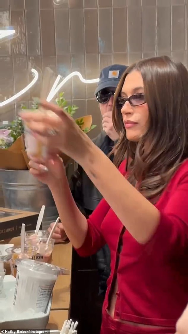 Hailey enlisted her singer husband, 29, to help make the sundaes they handed out to customers Monday afternoon at the Beverly Hills branch