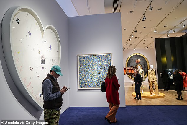 Another unique and valuable piece that John has ready to rehome is a custom piece by Damien Hirst (left) called 'Your Song', which was given to John by Hirst in 2008 - bidding starts at $350,000