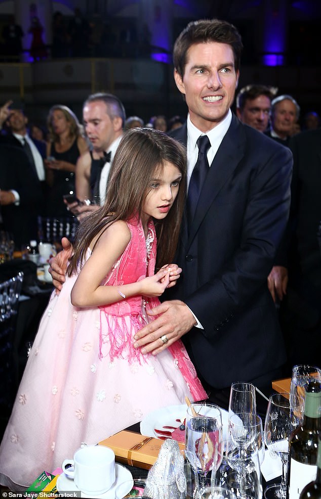 Although Cruise pays Holmes approximately $400,000 in child support for Suri, he is said to play 'no role' in his daughter's life