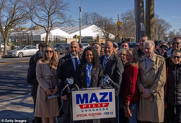 Mazi Pilip campaigns with the chairman of the National Border Patrol Council outside a migrant center.  Border security has been a heated topic of debate during New York's special election