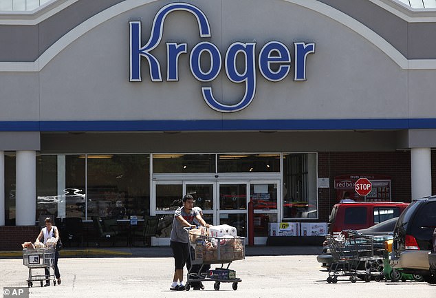 The CPI index for food at home has risen the most in a year.  The photo shows shoppers outside a Kroger in Dearborn, Michigan