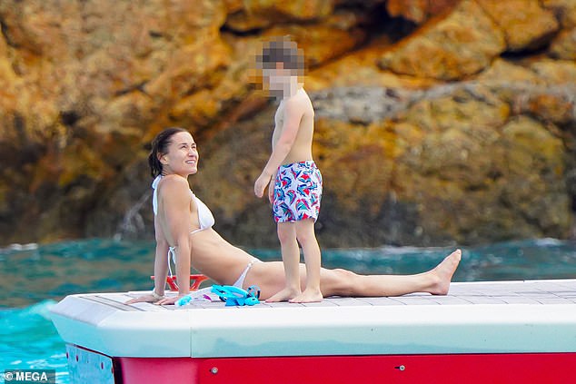 Pippa Middleton was seen lying on a diving rack with her son Arthur as her sister recovered from abdominal surgery