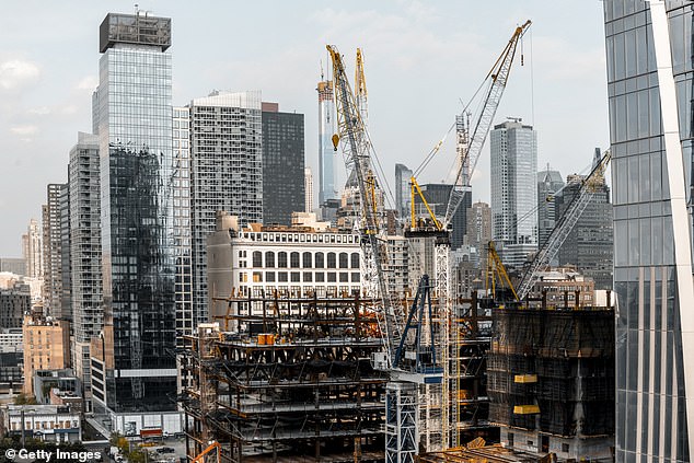 In 2019, cranes can be seen building skyscrapers in New York.  The number of cranes in Manhattan has fallen 69 percent in the past four years