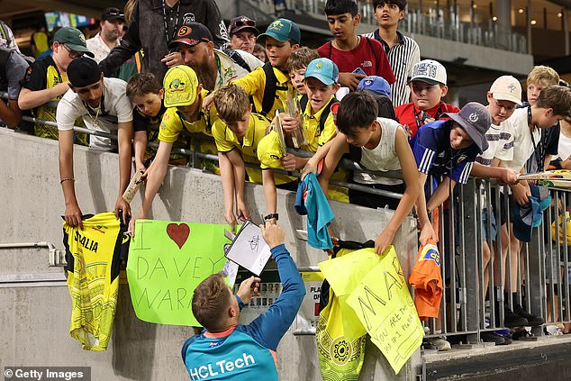 After the match, Warner signed autographs for children at Optus Stadium