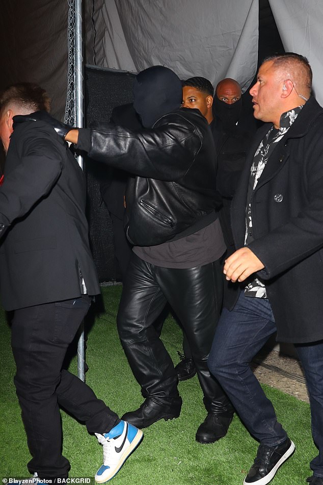 West was also photographed outside the venue, surrounded by security