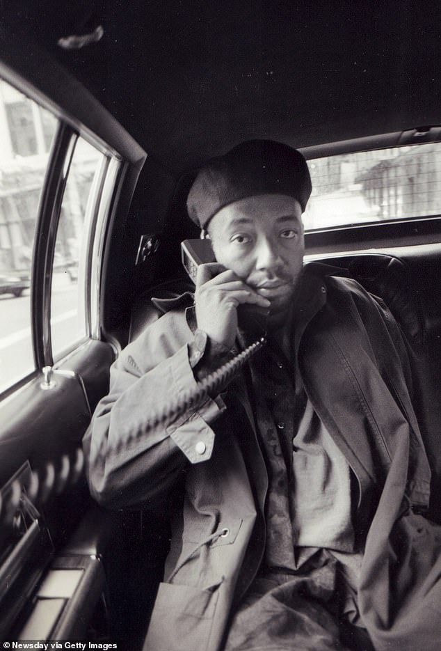 Simmons makes a phone call in Manhattan in 1991