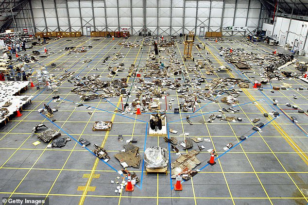 Debris from the Columbia Space Shuttle lies on the floor of the RLV Hangar on May 15, 2003 at Kennedy Space Center, Florida