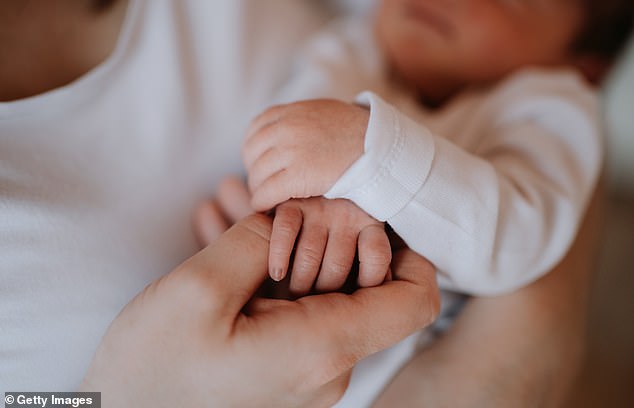 Holding hands is an instinctive action from birth to make it easier to hold our mothers.  A newborn baby will reflexively grab hold when you touch his or her palm