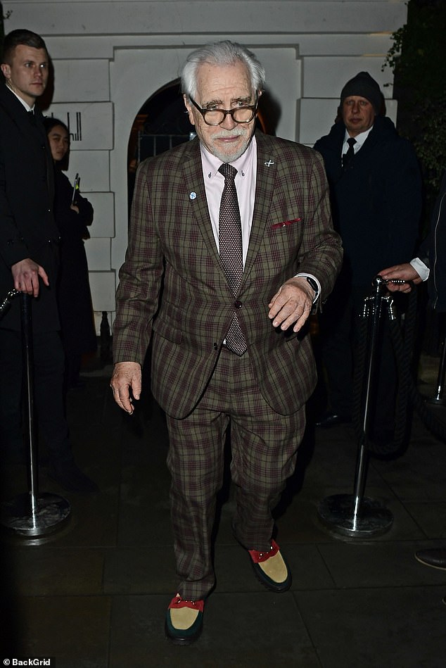 He turned heads with a pair of quirky red, tan and black suede loafers and added a burgundy patterned tie