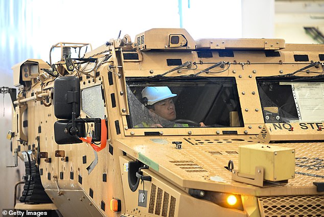 Armored vehicles from the 7 Light Mechanized Brigade, also known as 'The Desert Rats', were among the vehicles loaded for their journey from Anvil Point