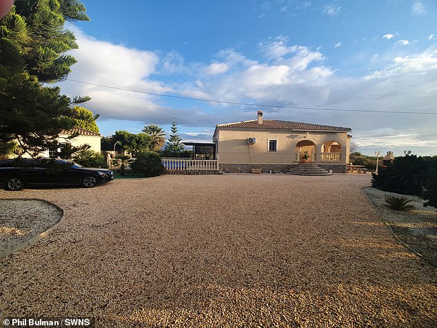 Phil and Anne Bulman's large house and additional property (left) in Almoradi, Spain