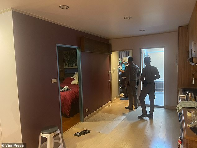 The Scottish suspects, identified only as 'William' and 'John', are said to have met with Burmese national Kyaw Zeyar, 50, for a business deal at the Saranjai Mansion apartment building (pictured during police investigation) in Bangkok on Tuesday evening.