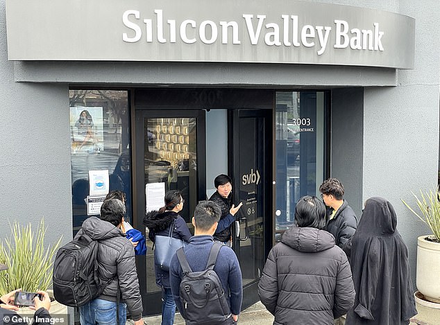 Rising interest rates wiped out the $1.8 billion the SVB had invested in U.S. government bonds.  And as news of those losses spread, desperate customers rushed to withdraw their deposits, drying up what little reserves SVB had left.  (Above) A bank employee tells customers that the Silicon Valley Bank (SVB) headquarters is closed