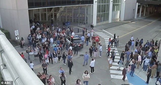 Moreno's son was shot during the rampage.  It is still unclear who exactly shot the boy.  Pictured: Crowd leaving the church during the shooting