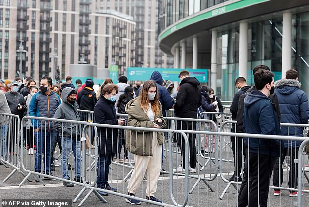 Some 157 million Covid vaccines have been delivered in England since the rollout began in December 2020.  Pictured: People queuing outside Wembley Stadium for a Covid jab in December 2021