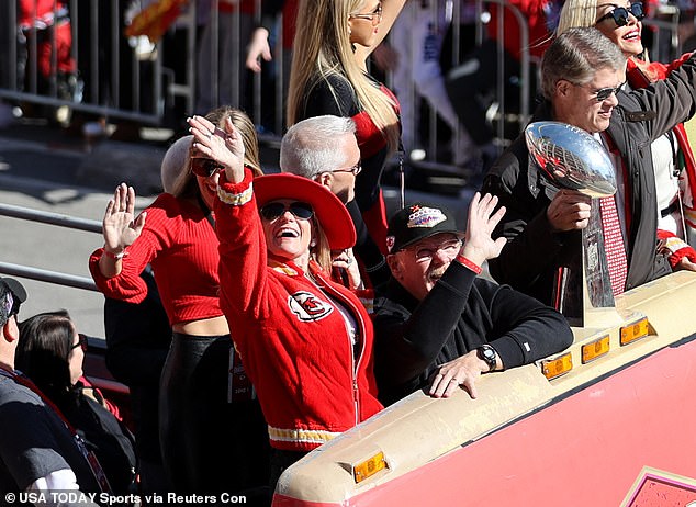 Reid was at Wednesday's parade with his wife Tammy, seen wearing a red Chiefs outfit