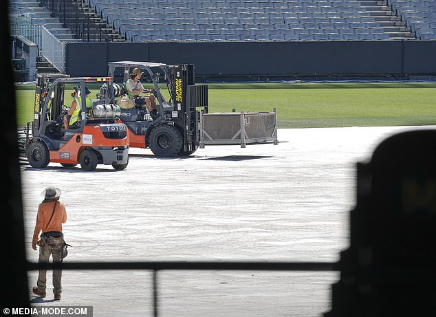 Several forklifts were present to help set up the stage