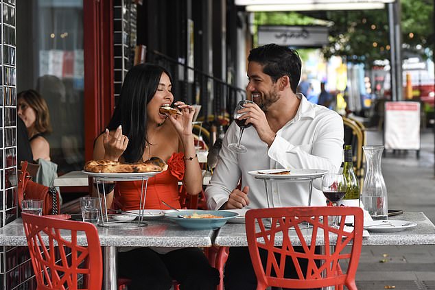 The couple stared into each other's eyes as they had a conversation over dinner