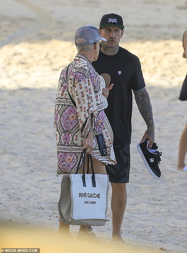 Pink was seen deep in conversation with husband Carey