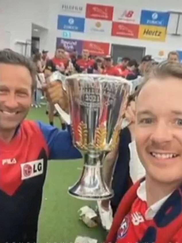 Mr Burbank (left) hopped across the border into the Northern Territory before traveling to Washington to watch the Melbourne Demons win at Perth Stadium