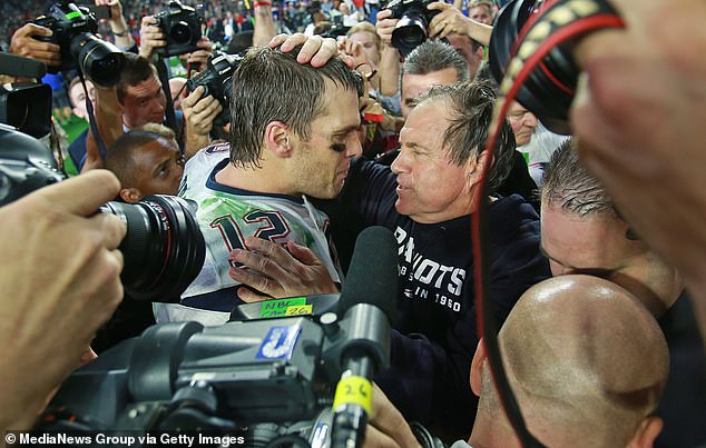 Tom Brady receives a hug from head coach Bill Belichick after the Super Bowl victory over the Seahawks