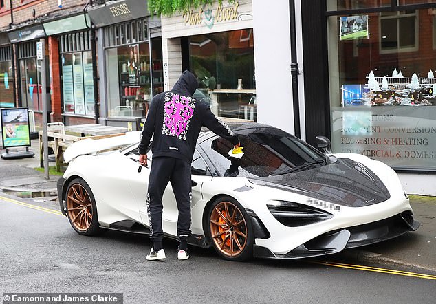 Man United star collected the parking ticket before leaving in his McClaren 765LT