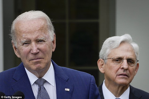 Attorney General Merrick Garland watches as US President Joe Biden speaks in the Rose Garden