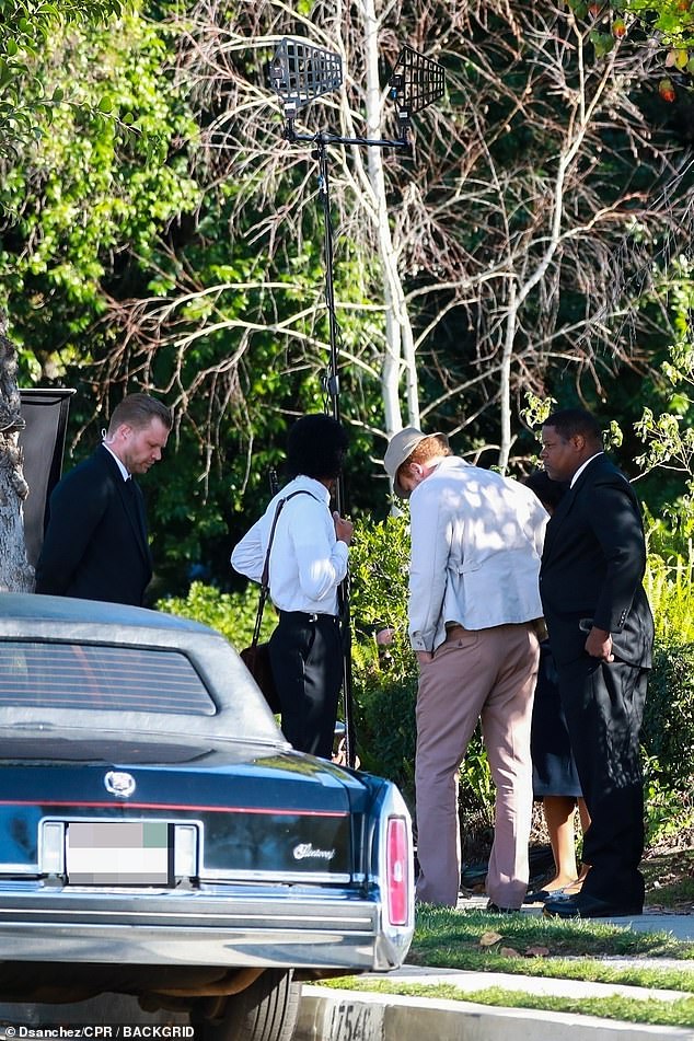 The scene was filmed in a house, with a black Cadillac on set, which could very well be a Cadillac hearse