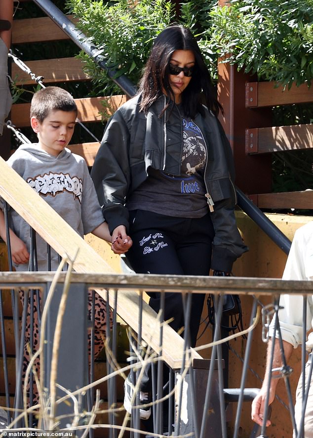 She was also seen at the zoo with her husband Travis Barker, who sweetly held her hand, although he was not seen during the animal encounter.