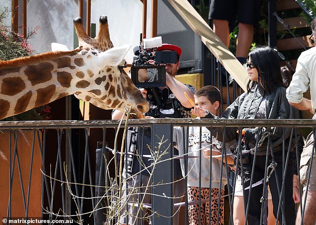 Kourtney appeared to film the interaction, possibly for her family's Hulu series The Kardashians, while a camera crew flanked her.