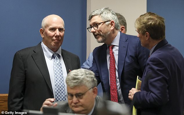 Attorney Steve Sadow and attorney Chris Anulewicz, representing defendant Robert Cheeley, speak among themselves during a break in a hearing in the case of the State of Georgia against Donald John Trump at the Fulton County Courthouse on February 15, 2024 in Atlanta, Georgia.  Sadow pressured Willis when the relationship with Wade ended