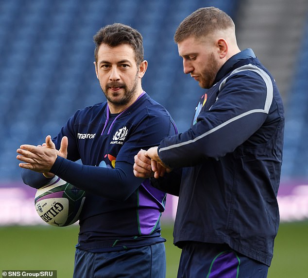 Former Scotland halfback partner Greg Laidlaw (left) claimed Russell was 'not cocky' but had 'so much confidence' that it rubbed off on the rest of the squad