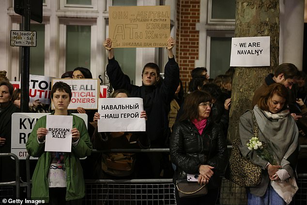 Protesters chanting slogans critical of Putin gathered outside the embassy in Kensington Palace Gardens next to Hyde Park this evening