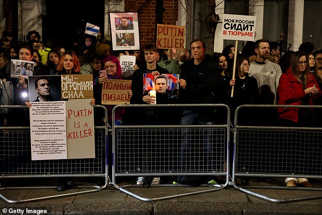 Members of the Russian diaspora protest outside the Russian embassy against the sudden death of Alexi Navalny