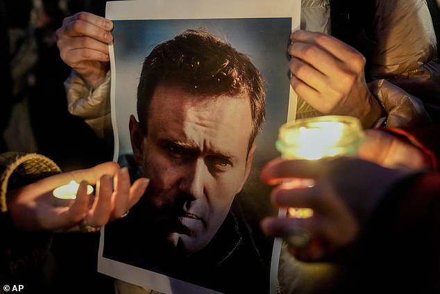 Protesters hold a vigil in Berlin to demonstrate against Navalny's death announced today