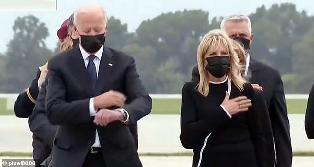 President Joe Biden checks his watch caught in TV photos Biden apparently looks disrespectfully at his watch during the dignified handover procedure honoring the 13 US service members killed in Kabul by a suicide bomber