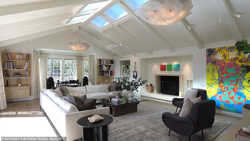 Large skylights on the ceiling allow natural light to flow into a number of areas, such as the living room