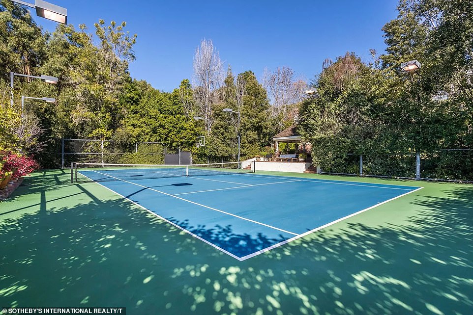 For fitness enthusiasts, there is also an outdoor tennis court on site, surrounded by a number of trees